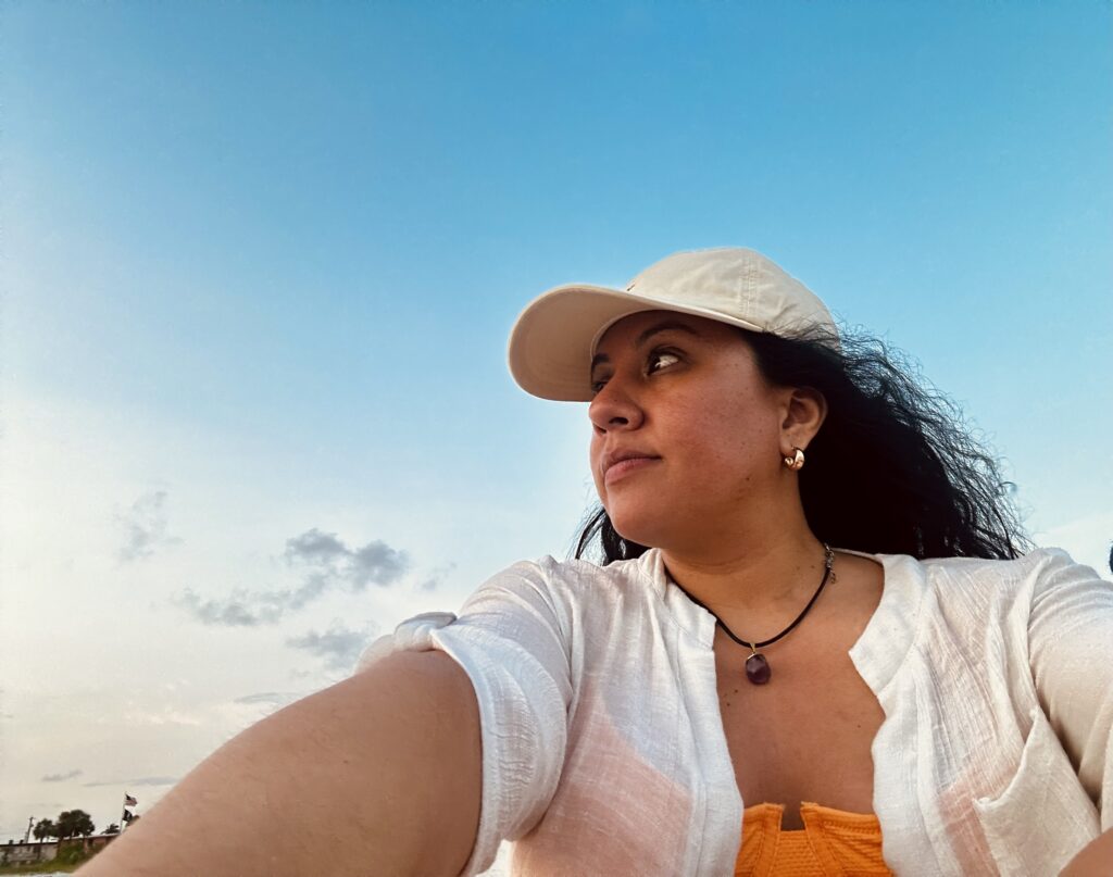 Woman at the beach, reflecting after receiving brain MRI results about a pituitary tumor